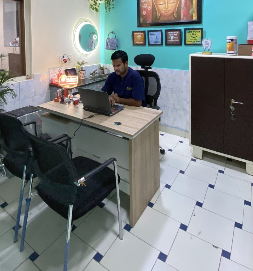 Dr. Bhupendra Singh Rawat at his desk in the consultation room